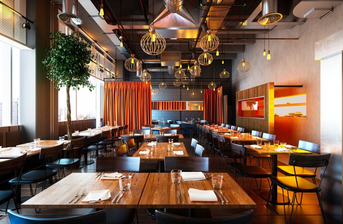 Finished restaurant dining room with pendant lighting and banquettes